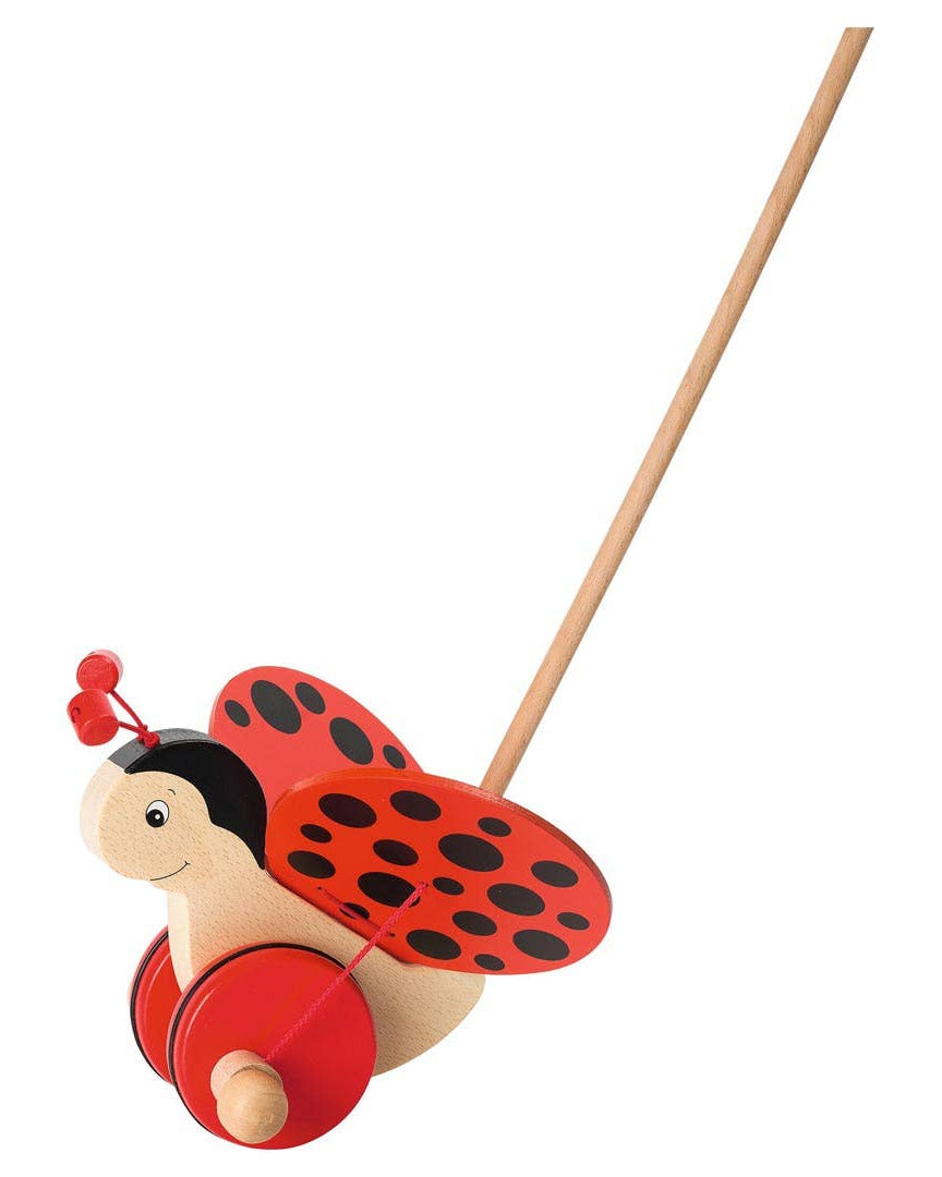 Wooden ladybug pull toy on a white background