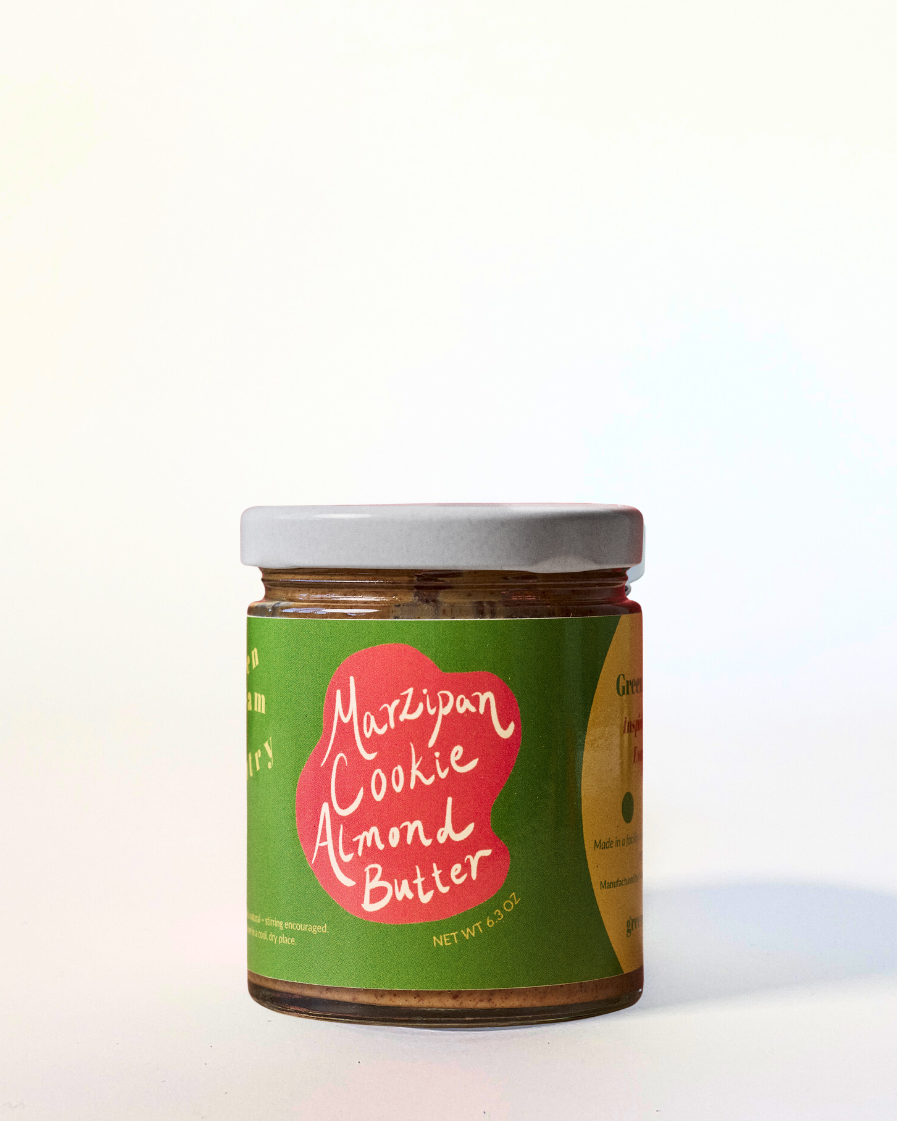 Jar of Marzipan Cookie Almond Butter with a green label on a white background
