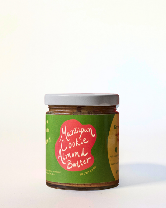 Jar of Marzipan Cookie Almond Butter with a green label on a white background