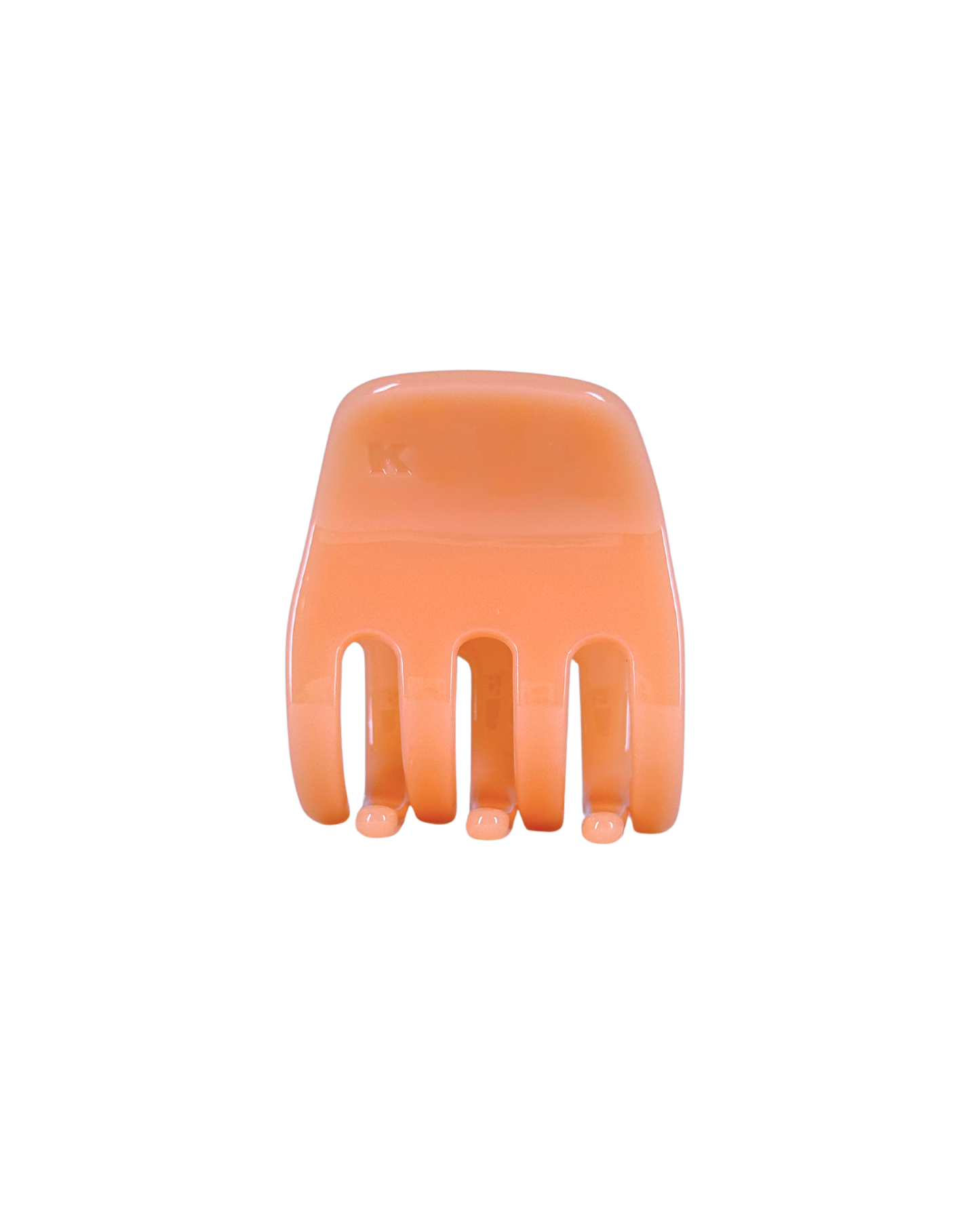 Orange hair comb on a white background