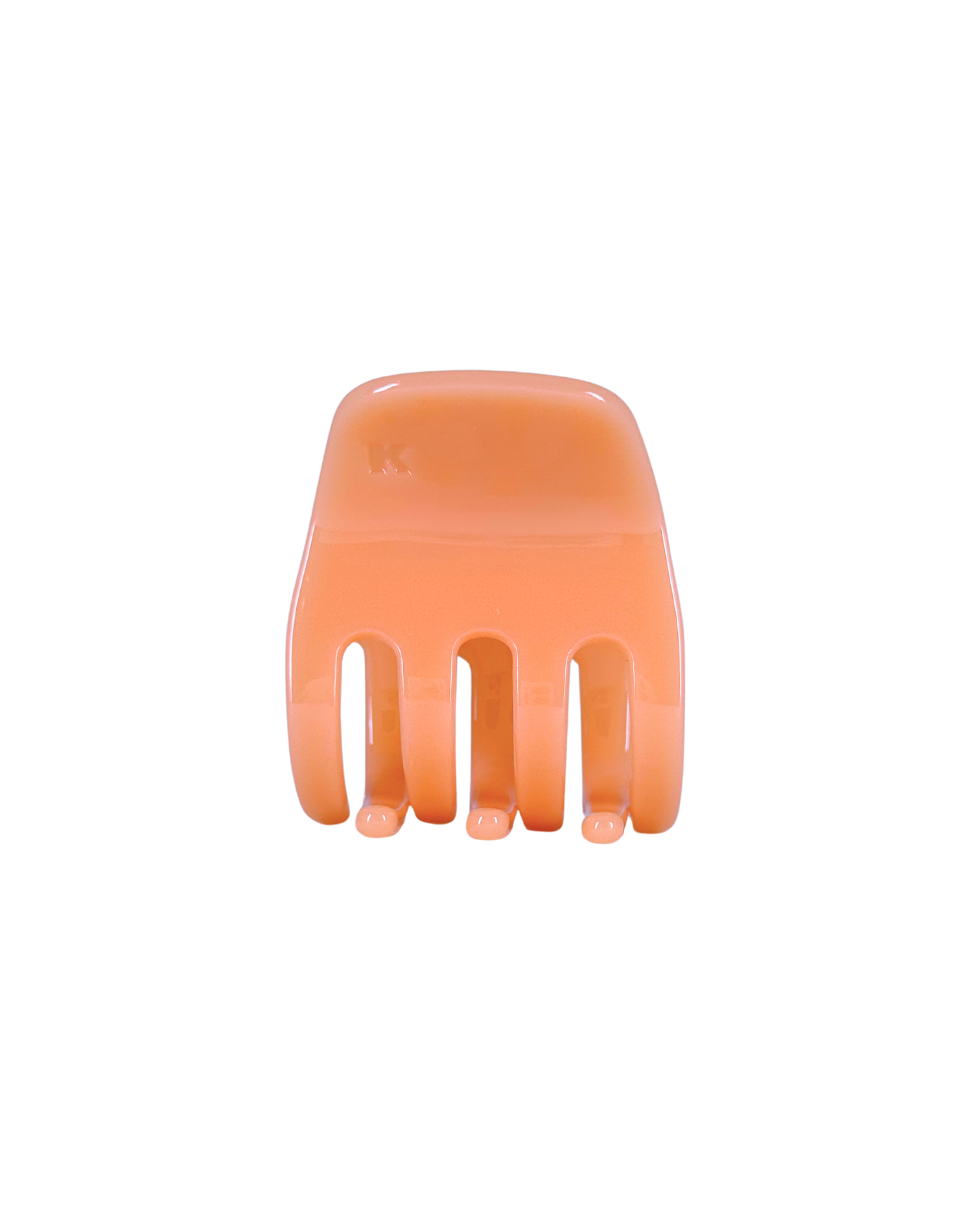 Orange hair comb on a white background
