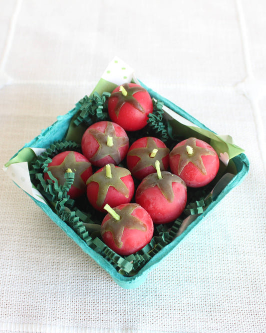 Decorative apples in a teal box on a white background