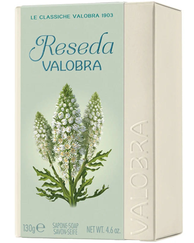 Reseda Valobra soap bar in its original cream-colored cardboard packaging, featuring a light green front panel with a botanical illustration of the plant and blue text.