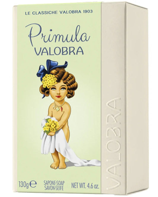 A boxed bar of soap labeled 'Primula Valobra' with a pale green front panel, cream-colored side panel, and an illustration of a young girl in a white dress holding yellow flowers. The brand name VALOBRA is embossed vertically on the side.