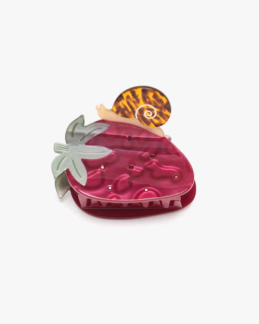 Pink strawberry-shaped container with a leopard print lid on a white background