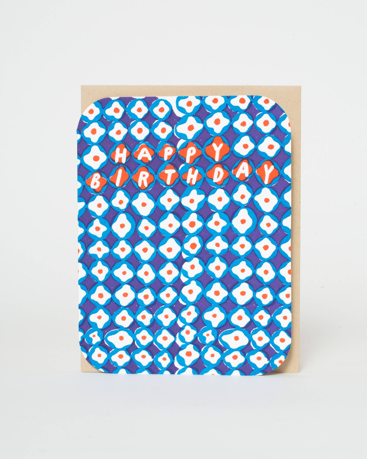 Greeting card with blue and white pattern and 'Happy Birthday' text on a beige background