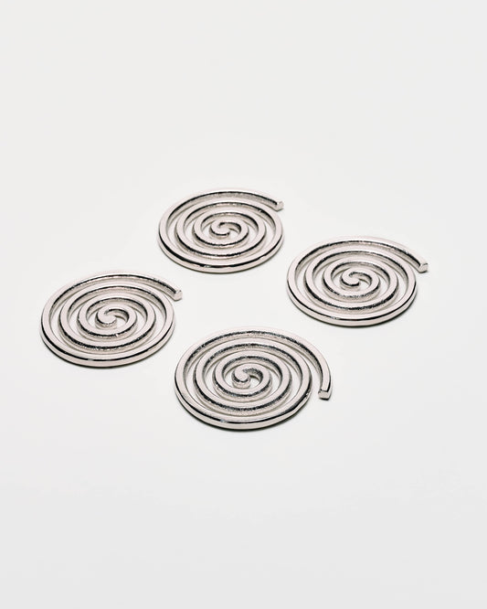 Four spiral-shaped metallic earrings in a silver finish, arranged on a plain light gray background.