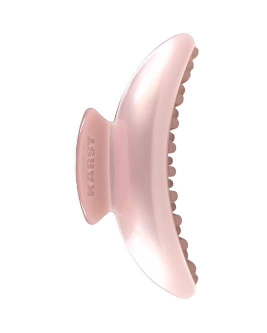 Pink hair clip with 'KARST' branding on a white background