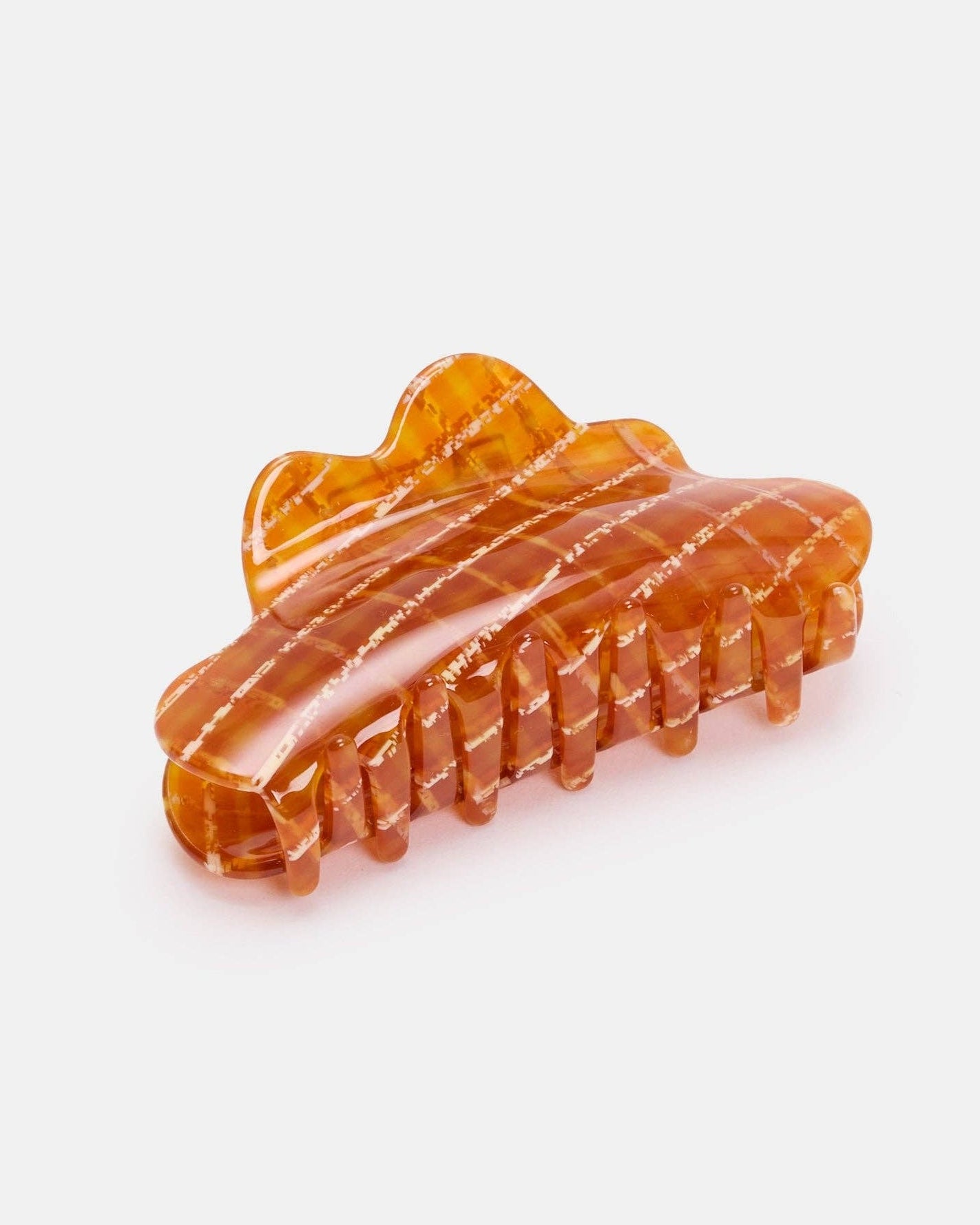 Orange hair clip on a white background