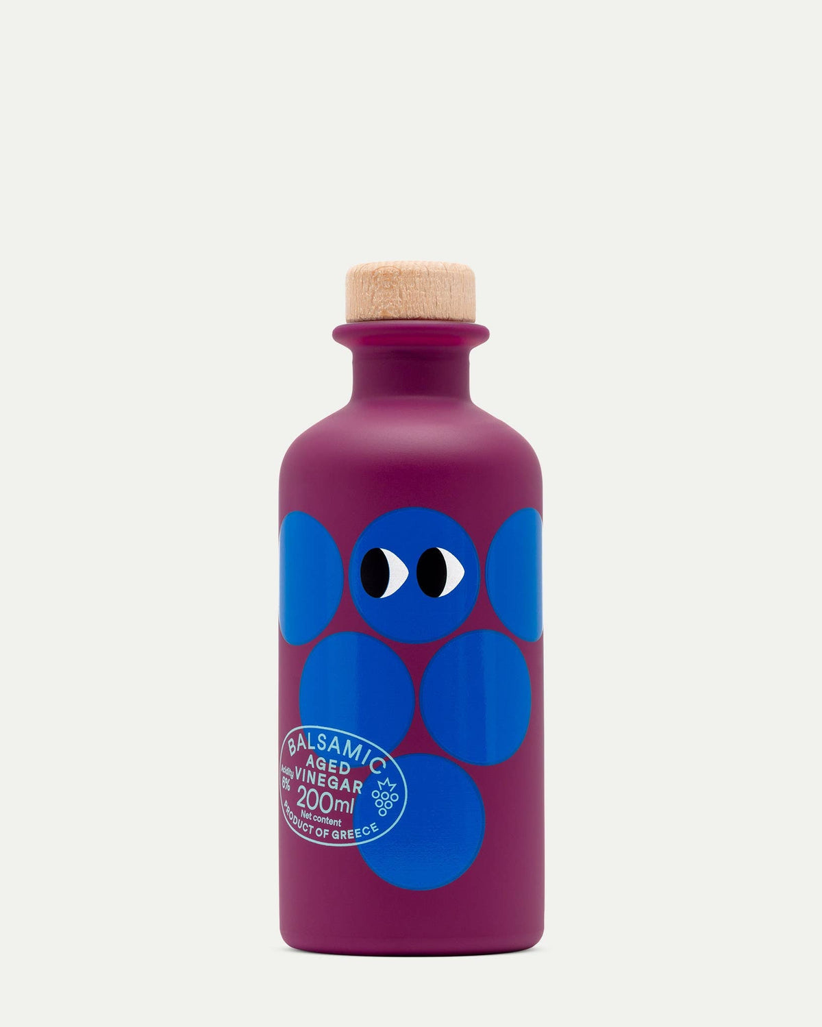Purple bottle with blue abstract design and cork cap on a white background