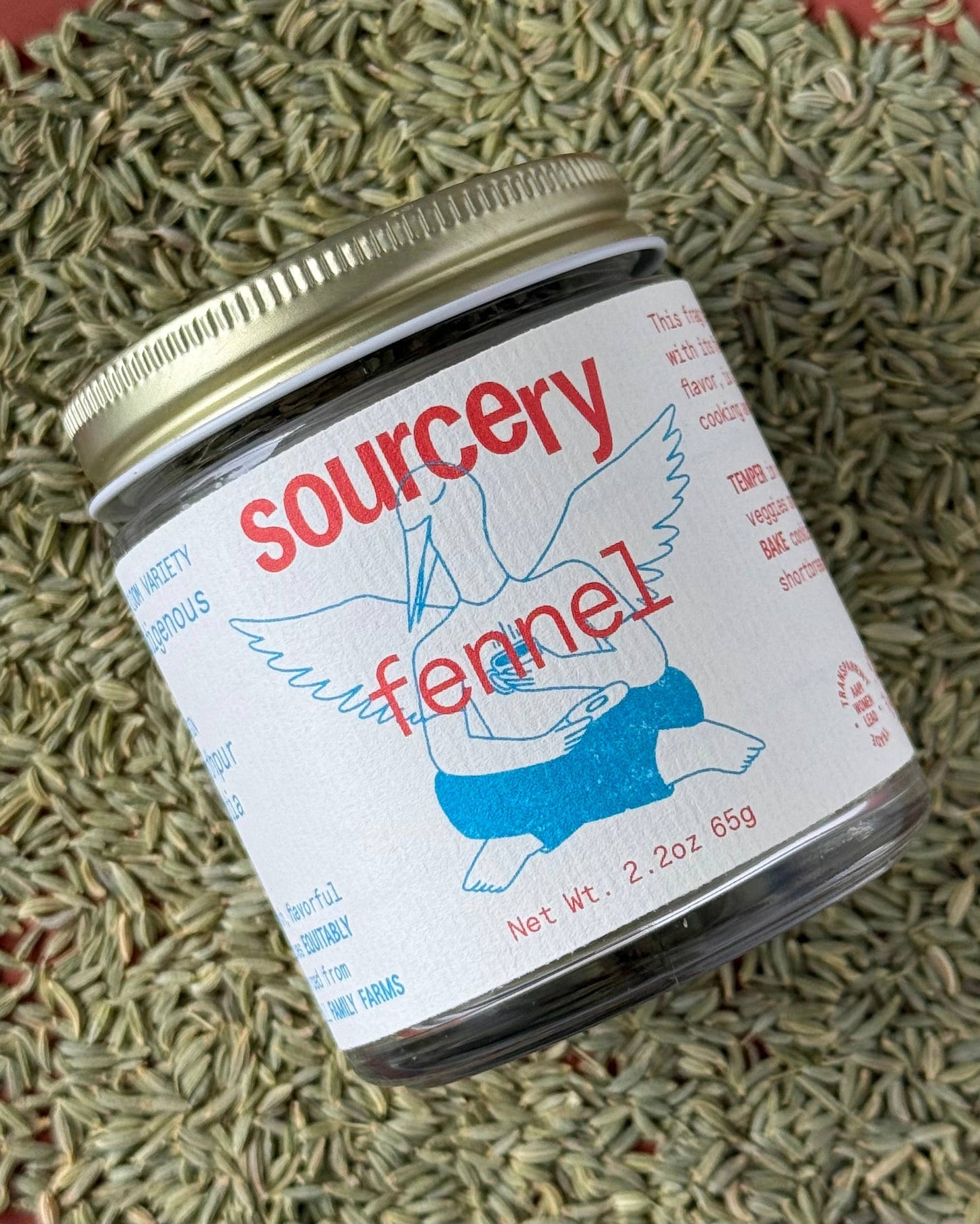 Jar of 'sourcery fennel' on a textured green background