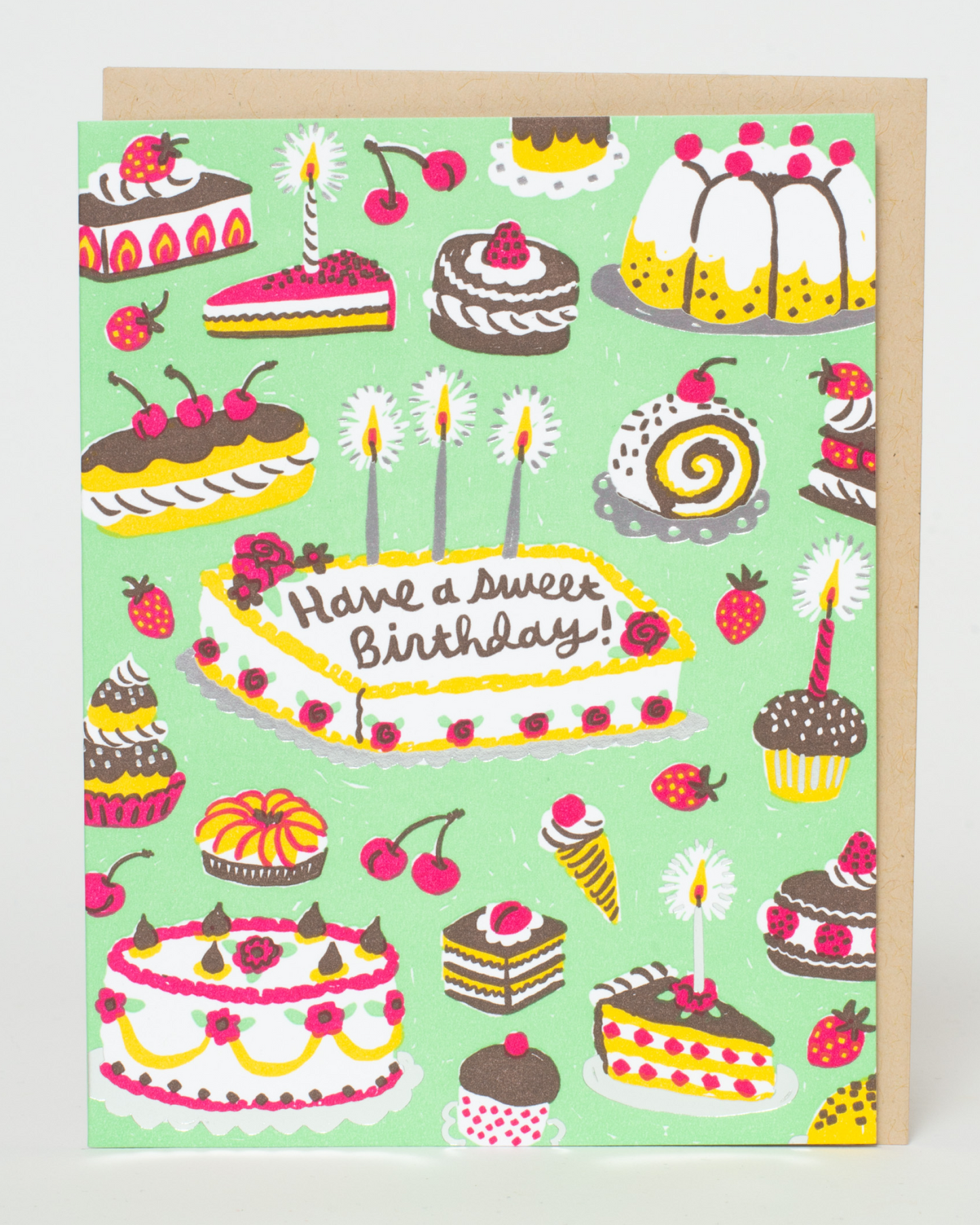 Greeting card with colorful birthday cake illustrations and 'Have a Sweet Birthday!' text on a light green background.