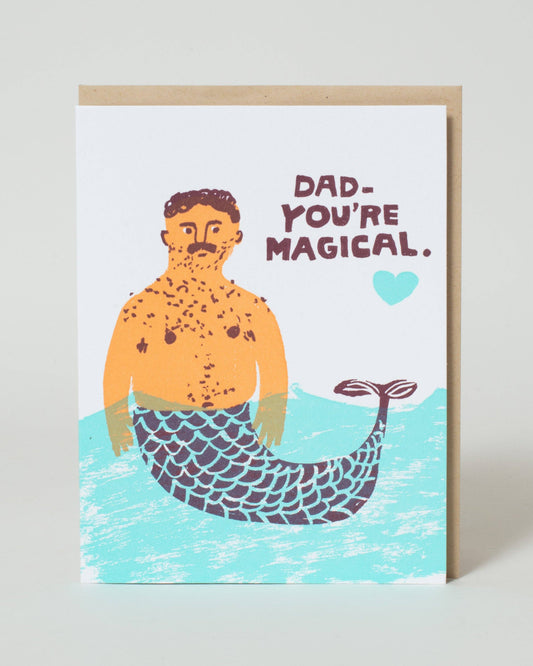 Greeting card with a merman illustration and text 'Dad, you're magical.' on a white background.