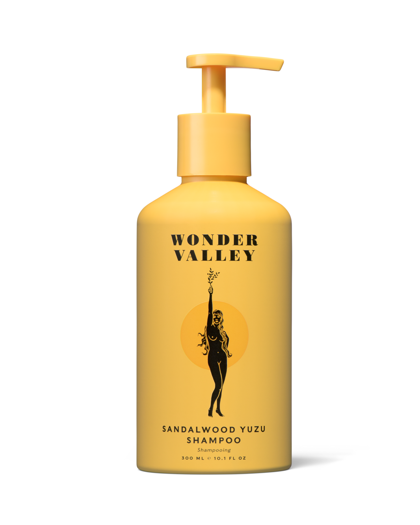 Yellow shampoo bottle with 'Wonder Valley' branding on a white background
