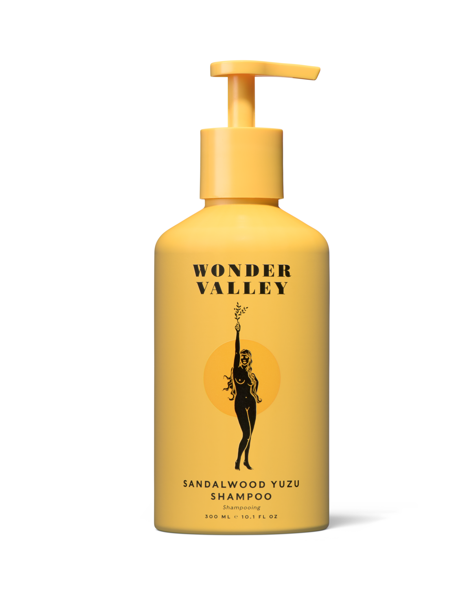 Yellow shampoo bottle with 'Wonder Valley' branding on a white background