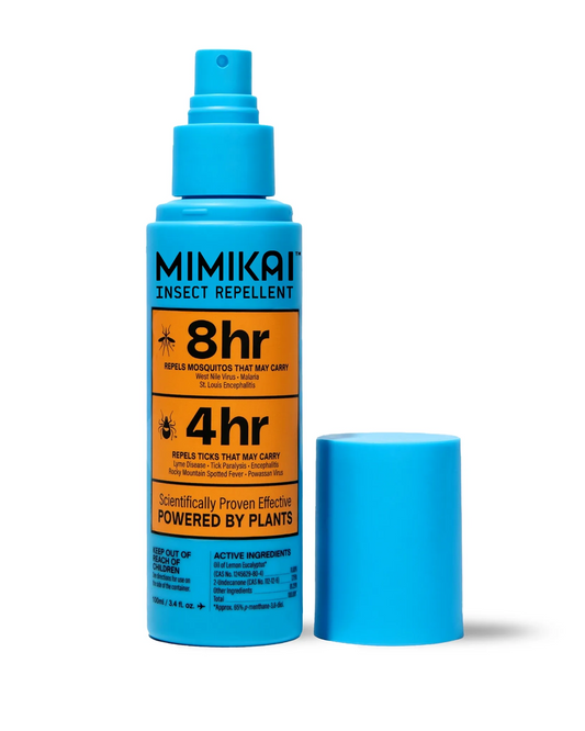 Blue insect repellent spray bottle with label on a white background