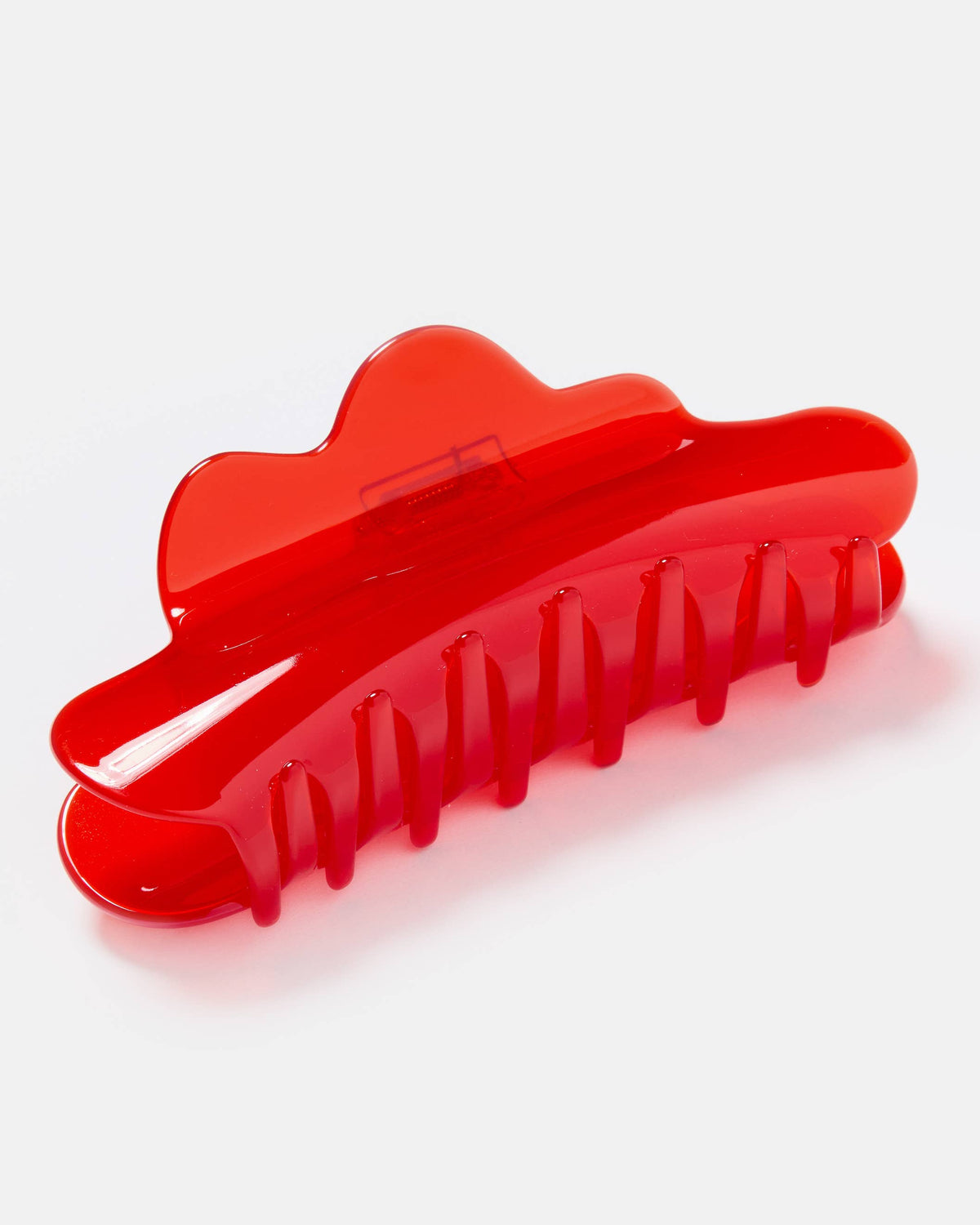 Red hair clip on a white background