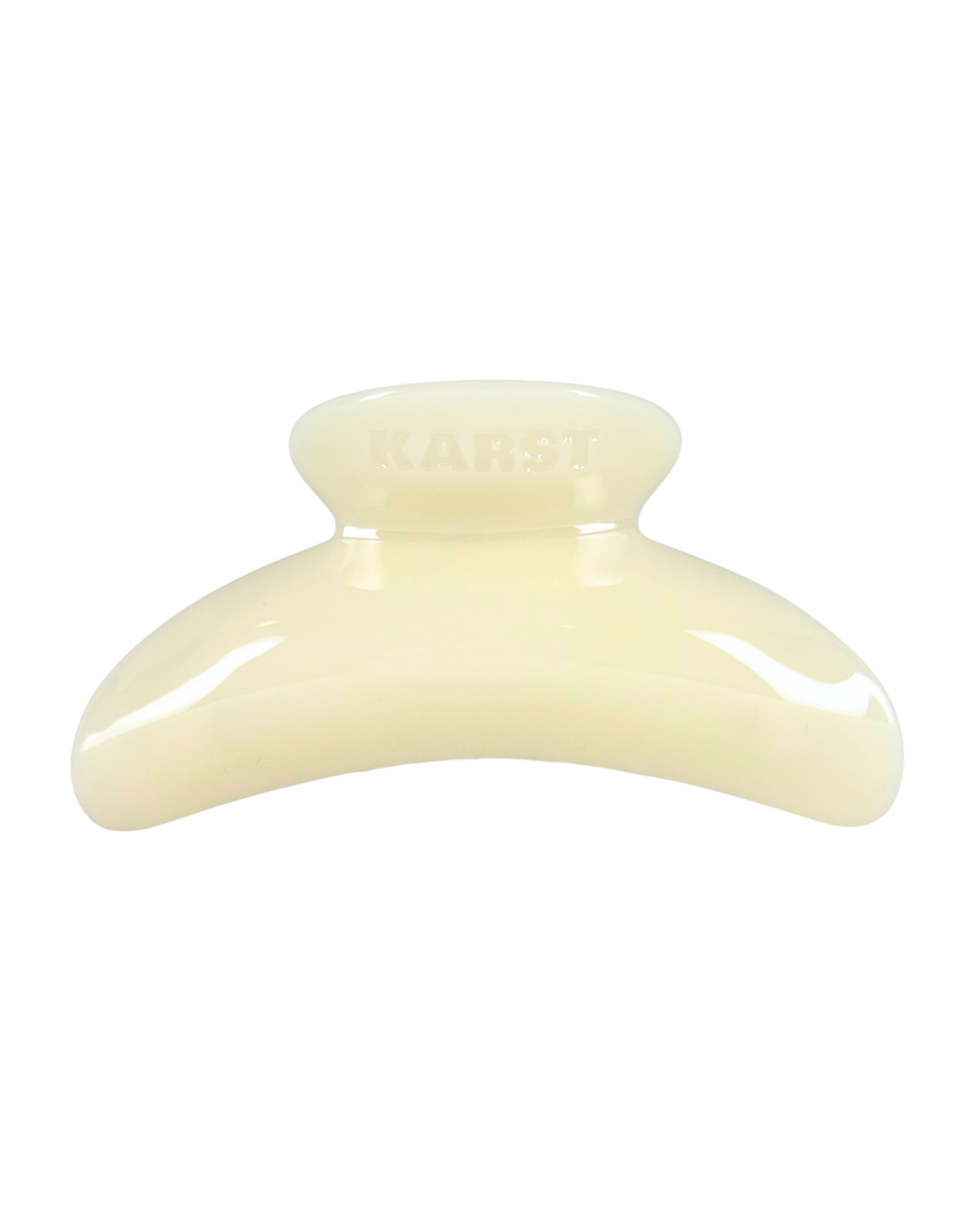 Cream-colored hair clip on a white background