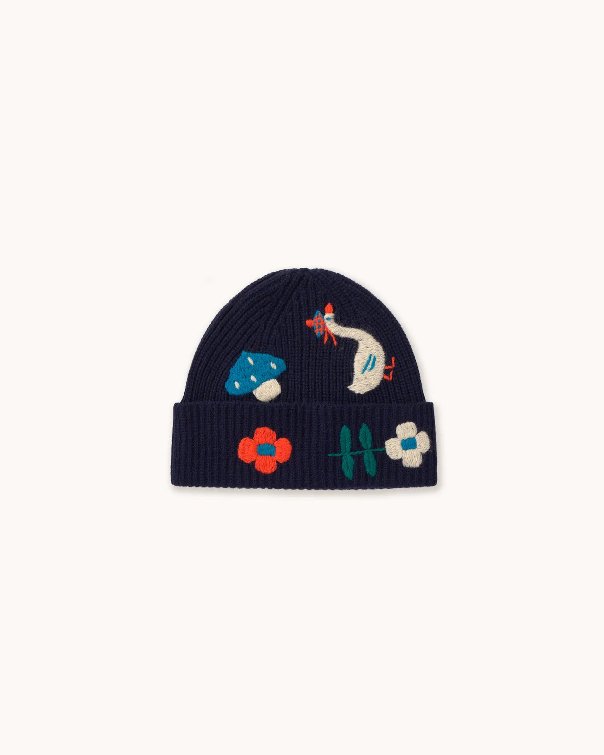 A navy blue knit beanie with embroidered wildflower and bird motifs on the front cuff, shown against a plain off-white background.