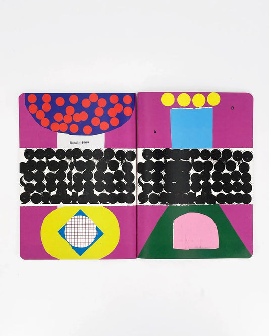 Colorful geometric pattern book open on a white background
