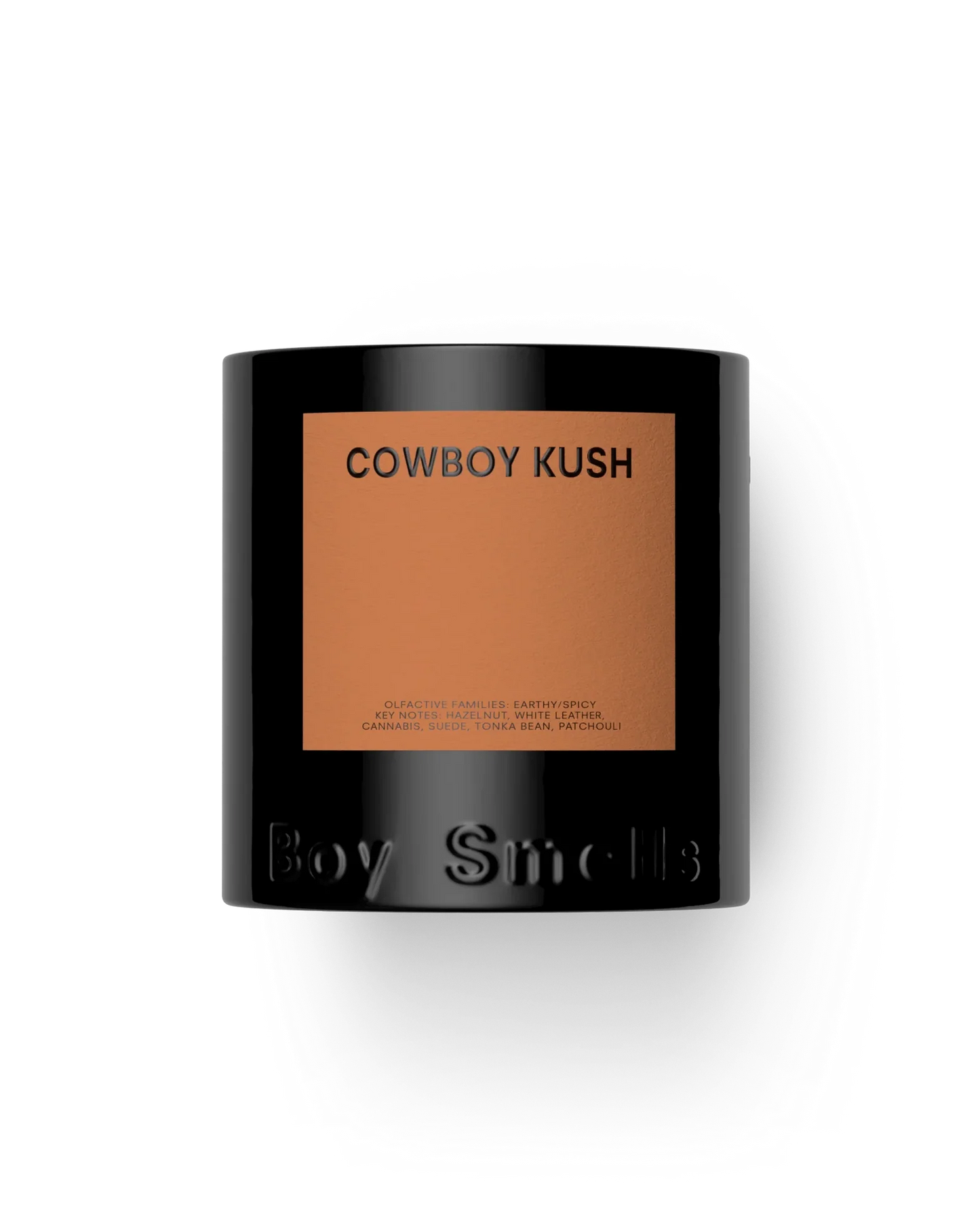 Candle with 'Cowboy Kush' label and 'Boy Smells' branding on a white background
