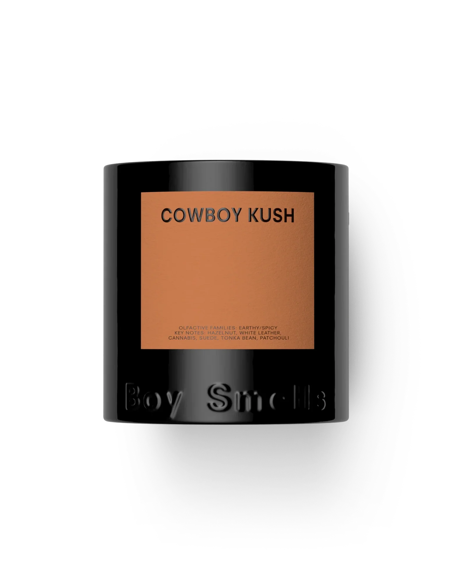 Candle with 'Cowboy Kush' label and 'Boy Smells' branding on a white background