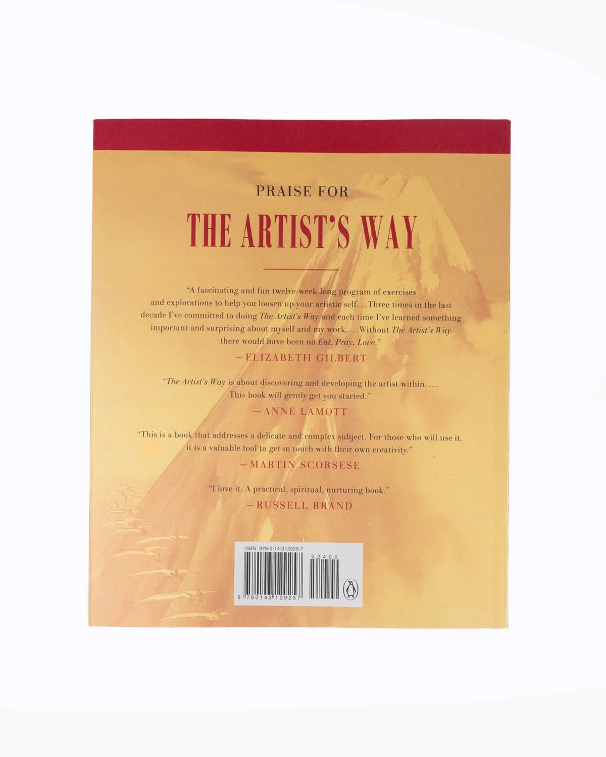 The back cover of the book 'Praise for The Artist's Way' by Russell Brand, featuring a warm beige and orange abstract background with a dark red top band and a barcode at the bottom.