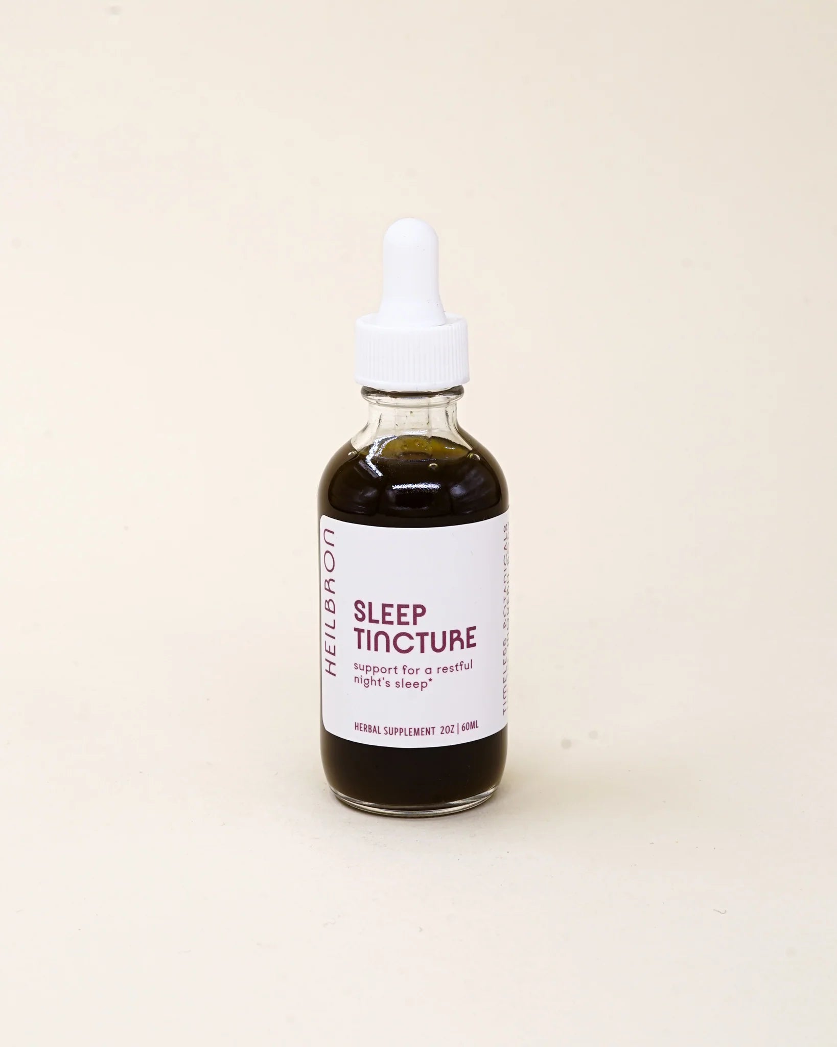 Sleep tincture bottle with dropper on a beige background