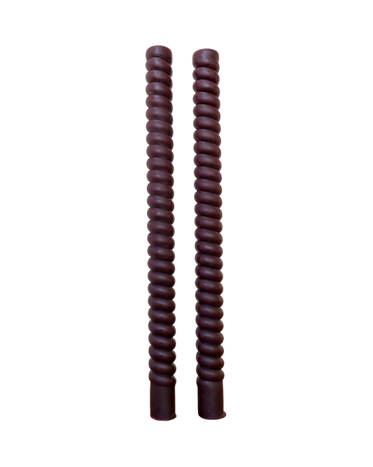 Two brown twisted sticks on a white background