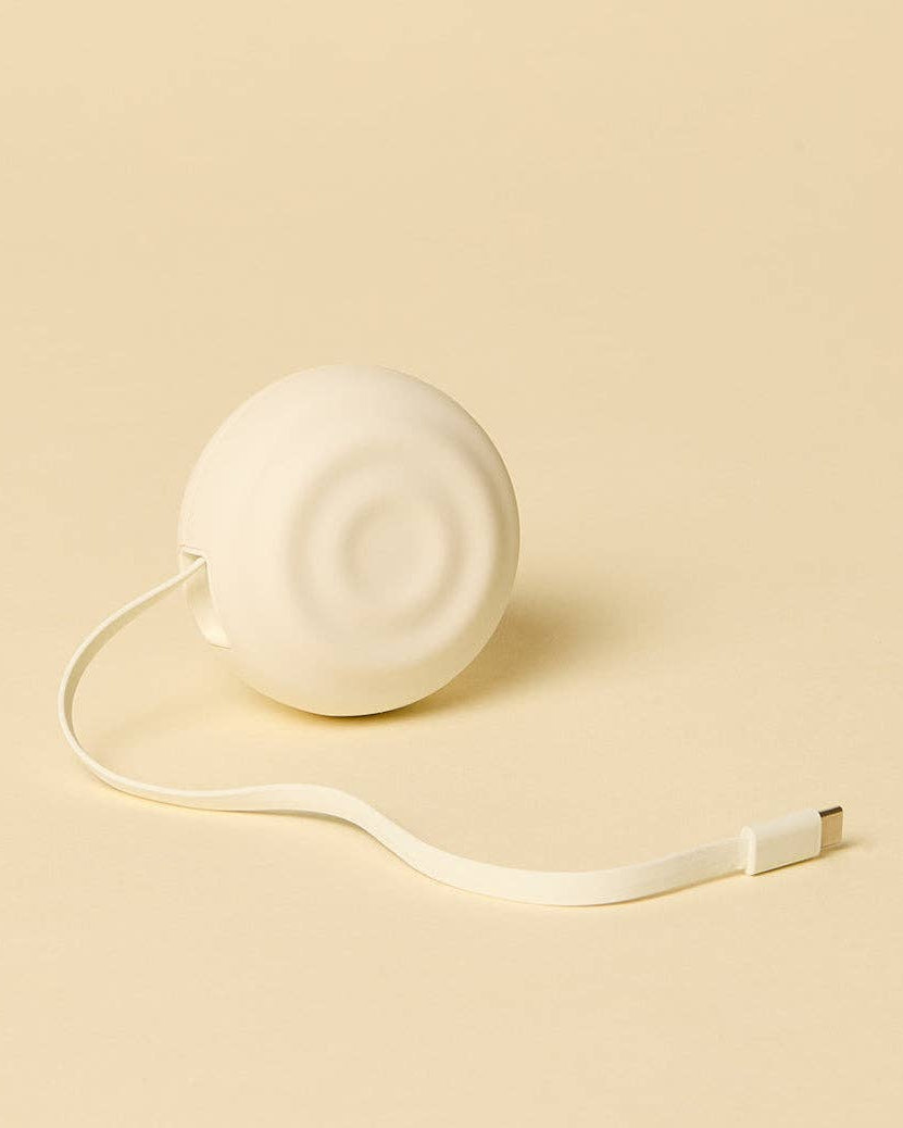 White tape measure on a beige background