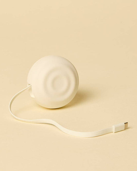 White tape measure on a beige background