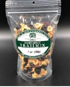 Clear bag of Northwest Trailmix with visible ingredients on a black background
