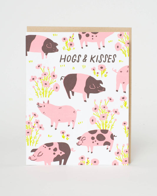 Greeting card with pink and brown pigs and flowers on a white background