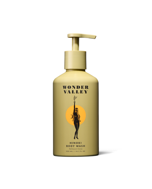 Yellow bottle of Wonder Valley body wash on a white background