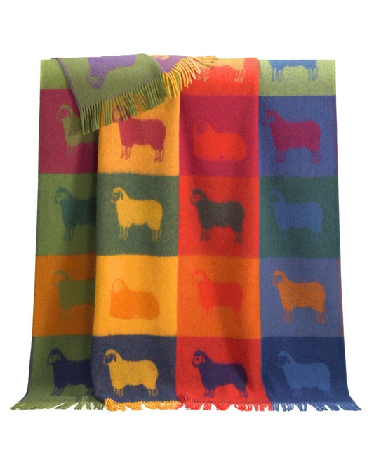 Colorful blanket with sheep pattern on a white background