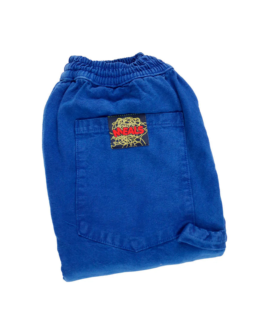 Folded blue shorts with a brand logo on a white background