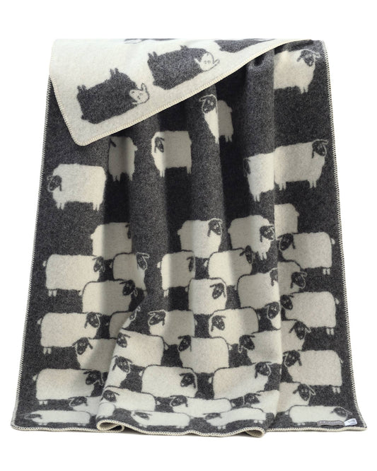 Blanket with black and white sheep pattern on a white background