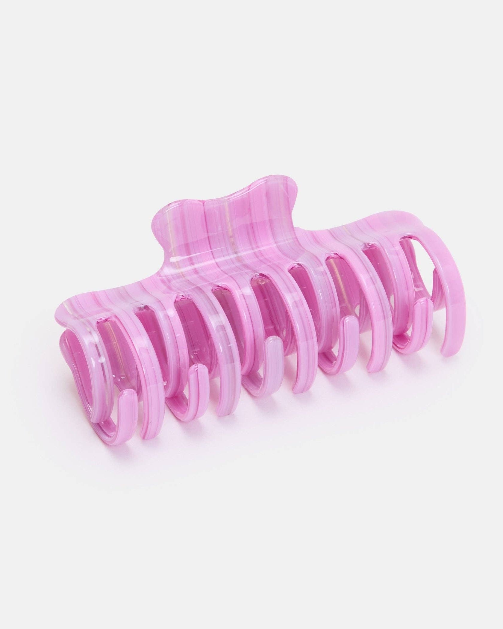 Pink hair clip on a white background