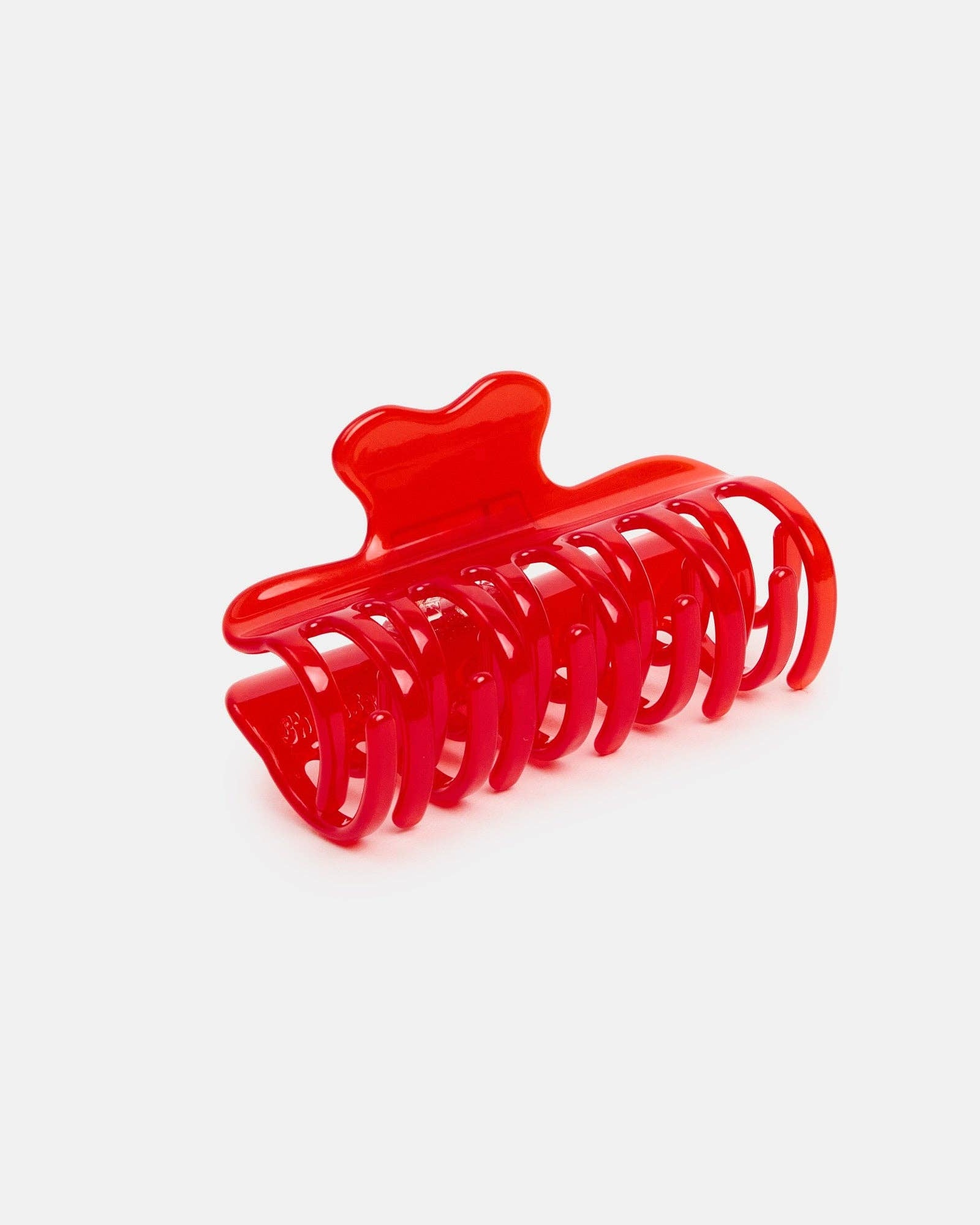 Red hair clip on a white background