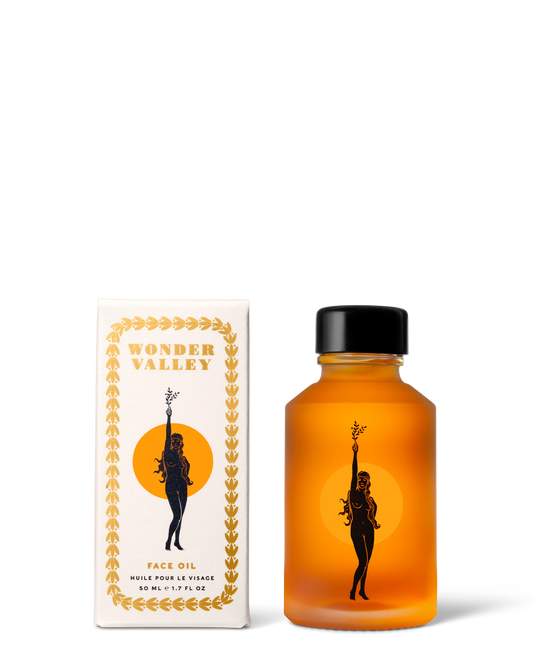 Orange bottle and box with 'Wonder Valley' branding on a white background