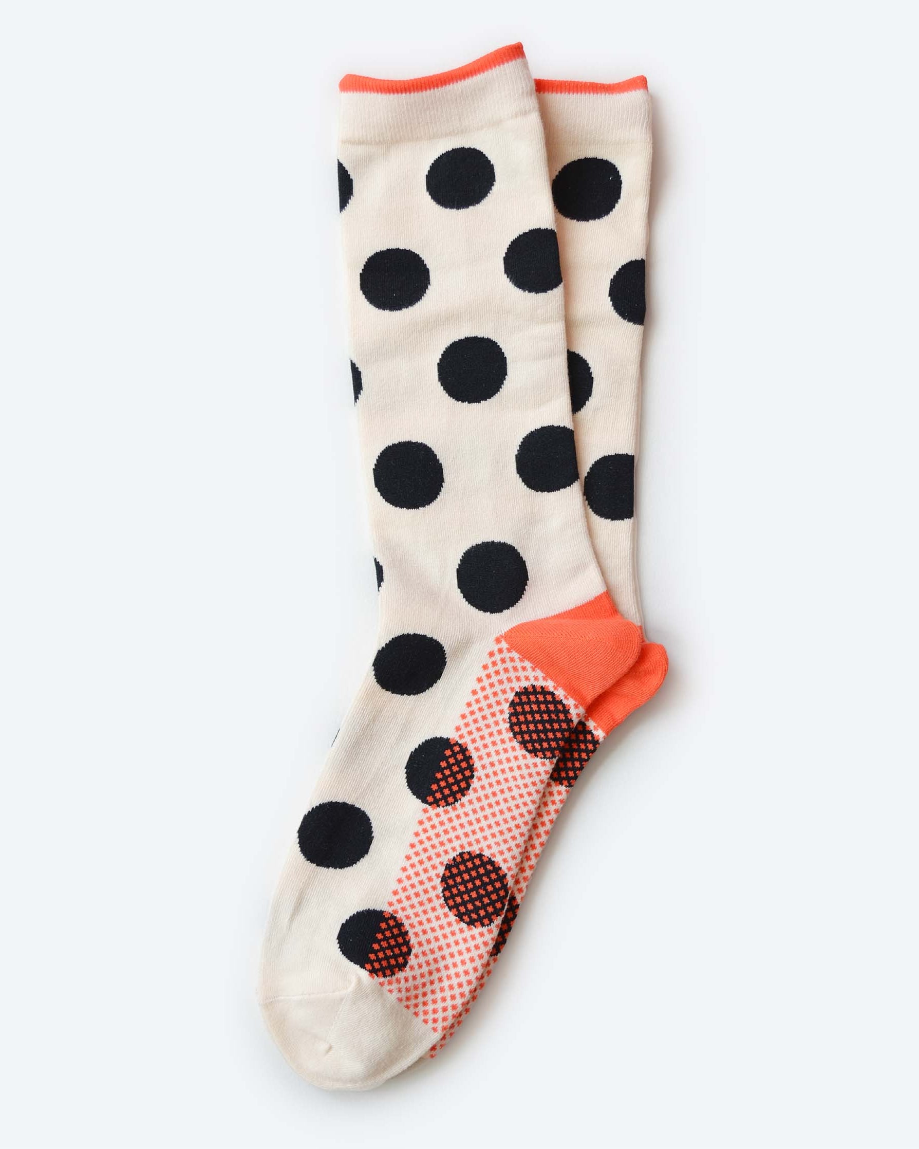 Polka dot socks with a patterned heel on a white background