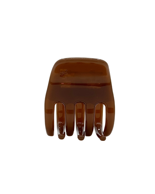 Brown hair clip on a white background