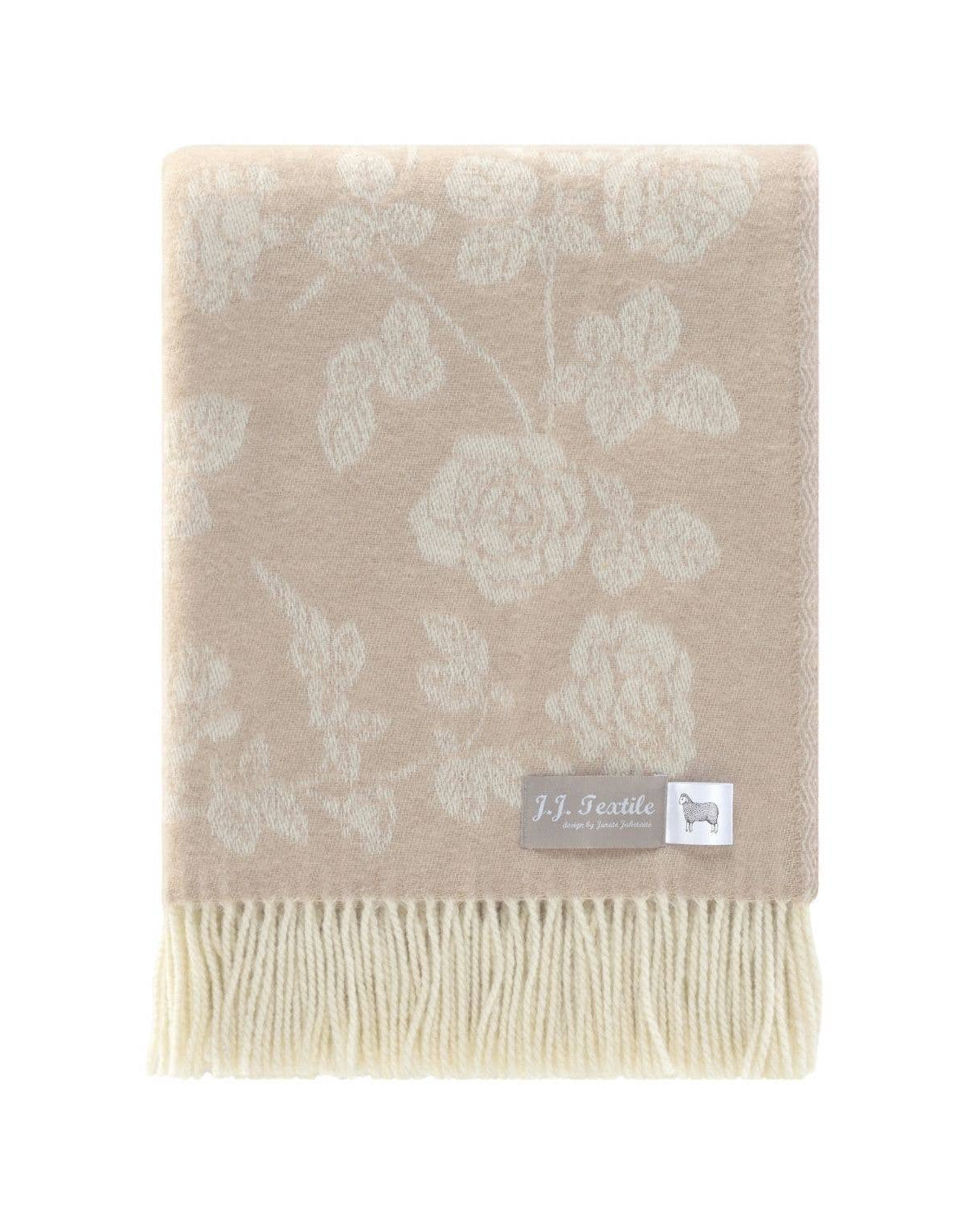 Beige floral patterned throw blanket with a brand label on a white background