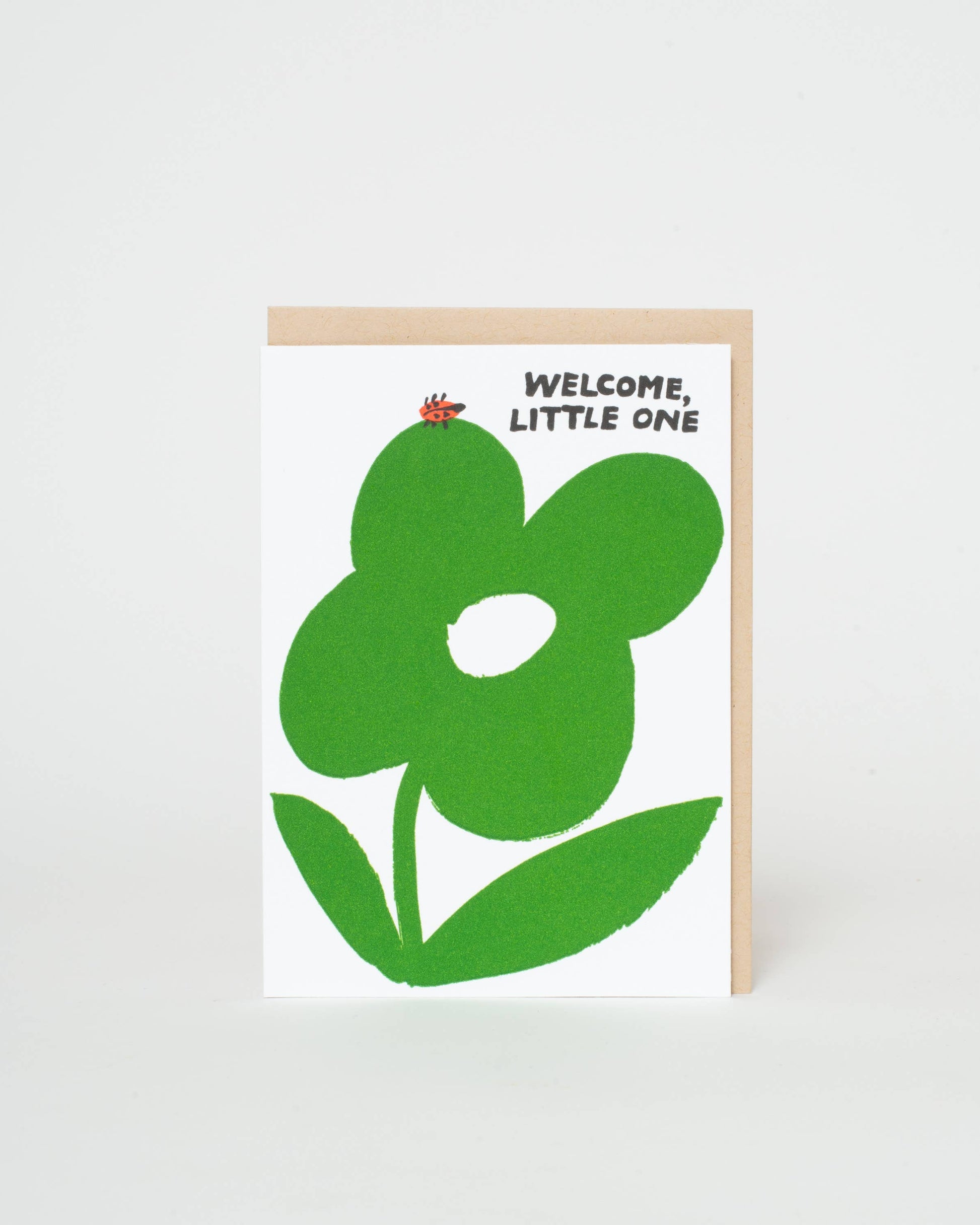 Greeting card with green flower design and 'Welcome, Little One' text on a white background