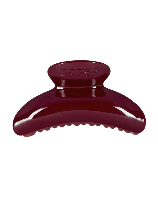 Maroon hair clip on a white background