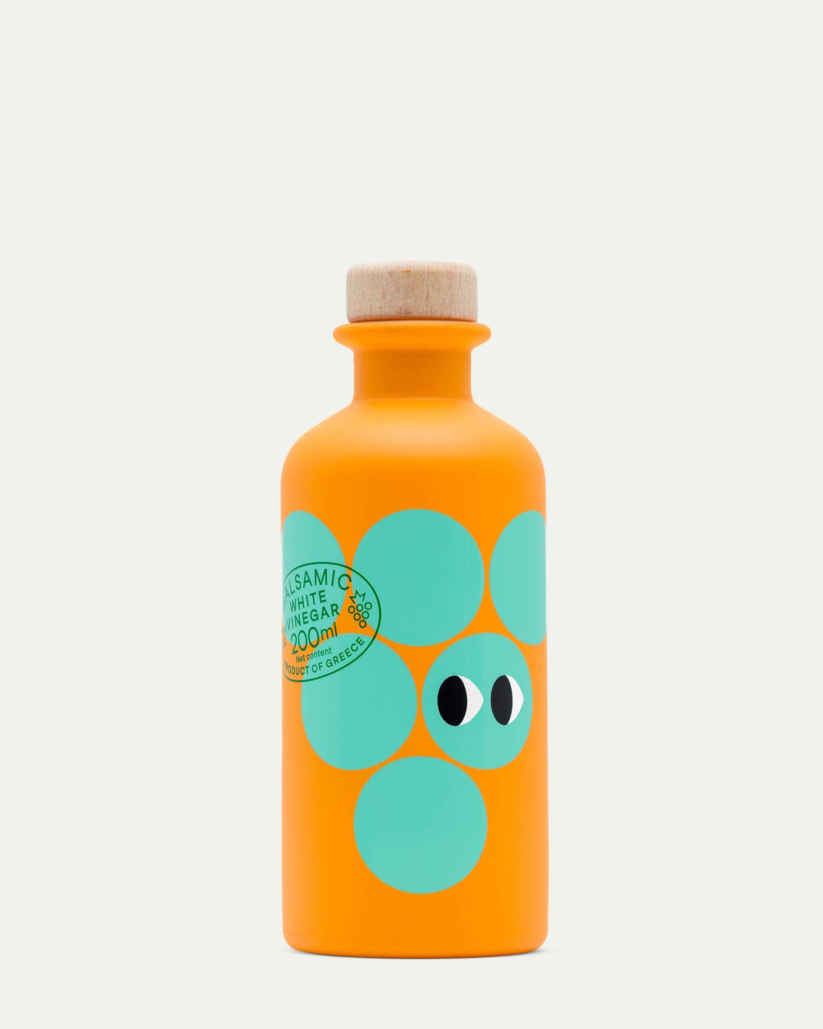 Orange bottle with green polka dot design on a white background