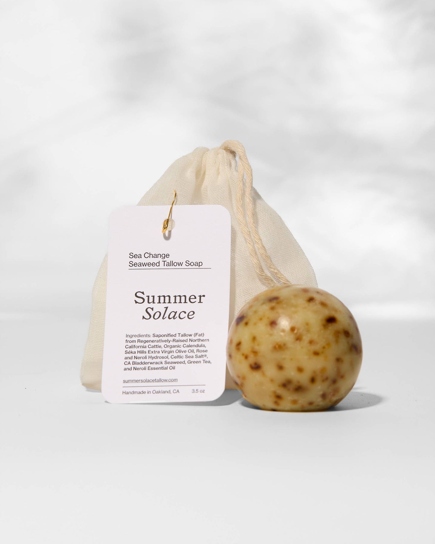 Bar of soap with a 'Summer Solace' label on a white background
