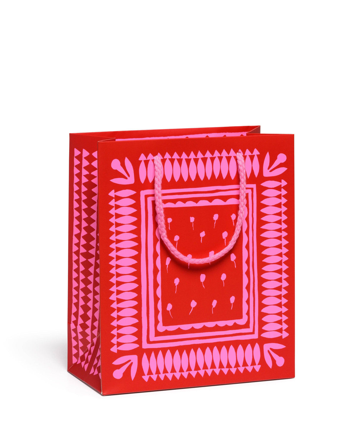 Red gift bag with pink geometric pattern on a white background