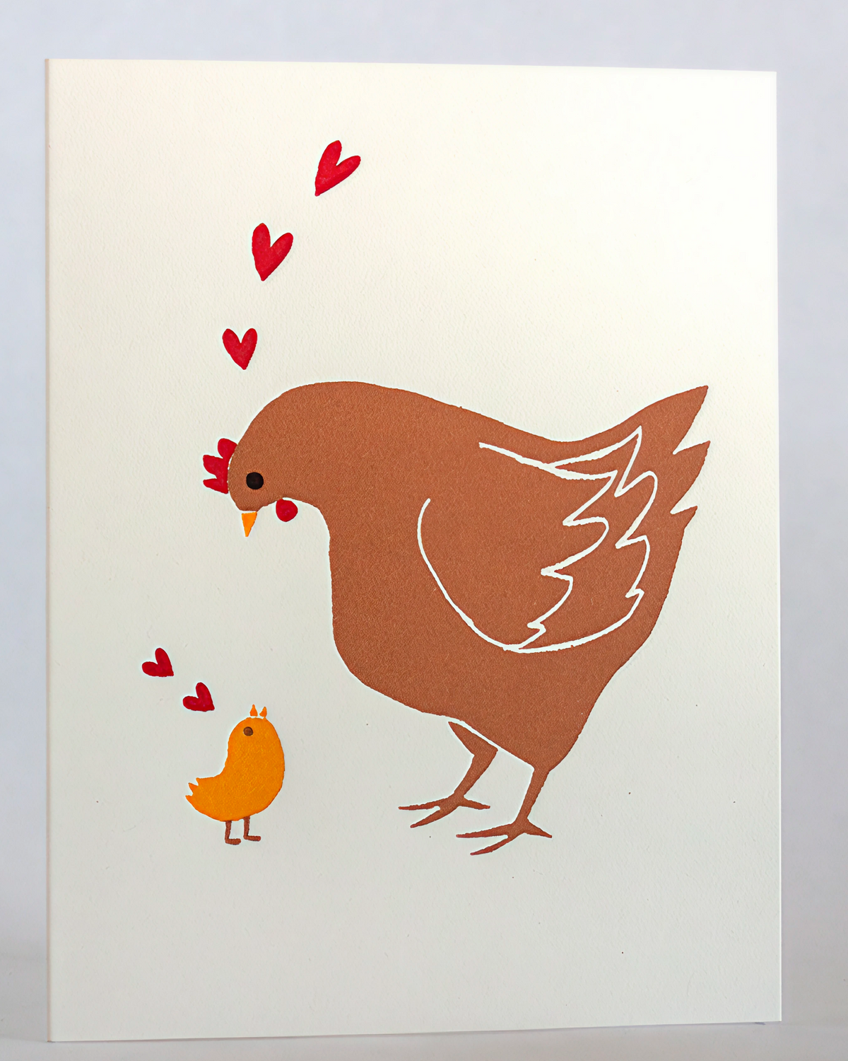 Letterpress printed illustration of a mother hen and chick on a white background with 'Letterpress Printed' text at the bottom.
