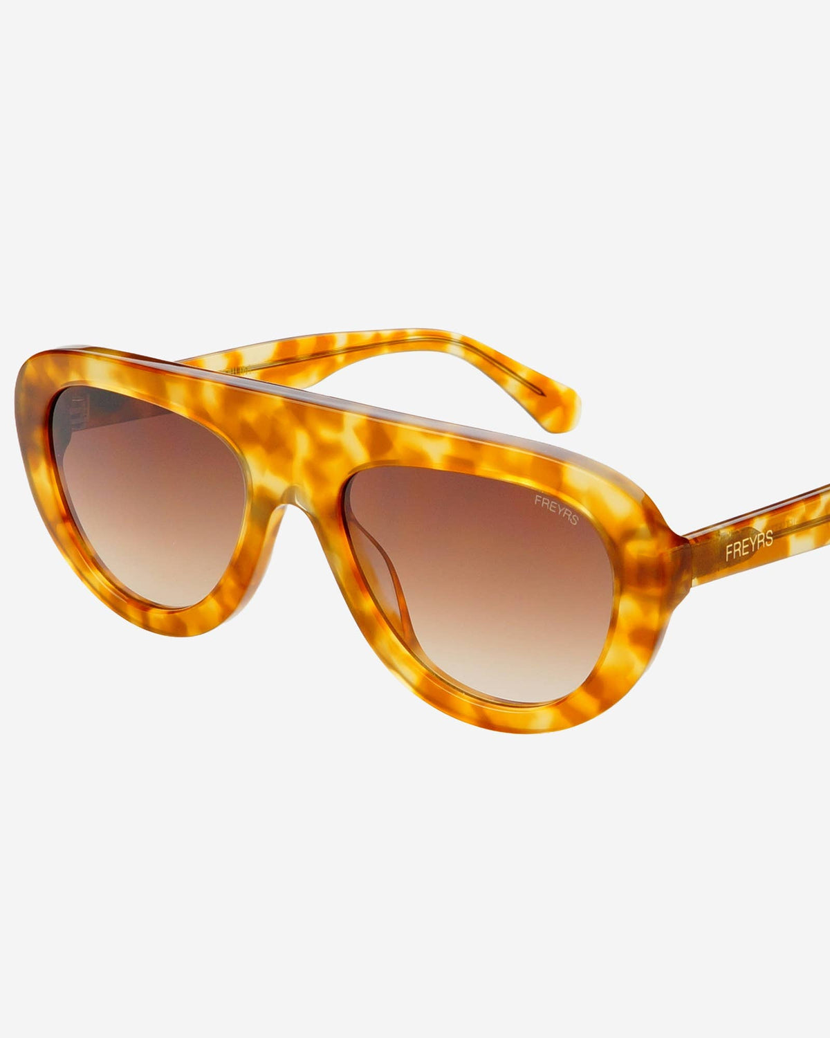 Tortoiseshell sunglasses with brown lenses on a white background